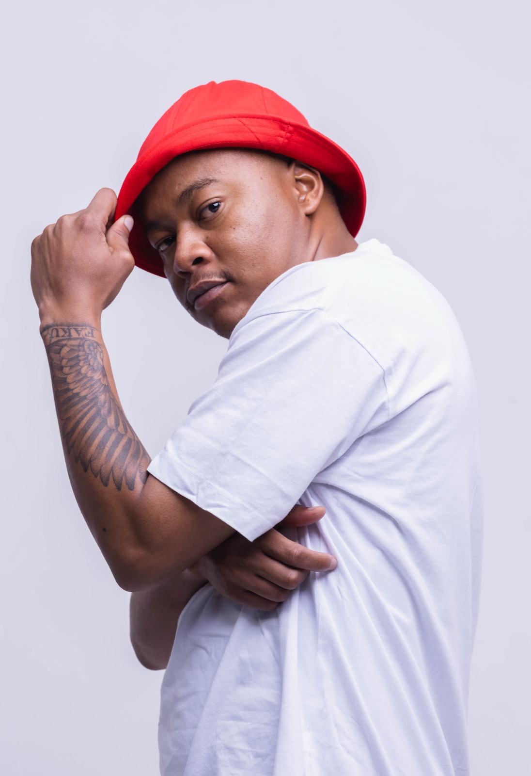 Mthizo in a red bucket hat